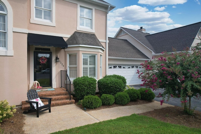 entrance to property featuring a garage