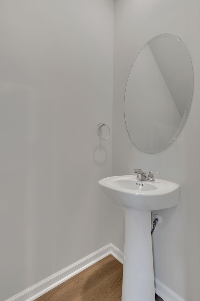 bathroom with hardwood / wood-style floors