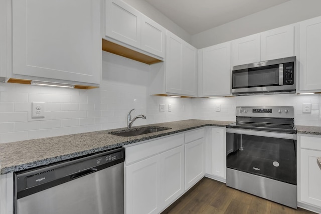 kitchen with white cabinetry, sink, and appliances with stainless steel finishes