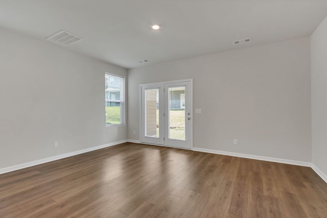 empty room featuring dark hardwood / wood-style flooring