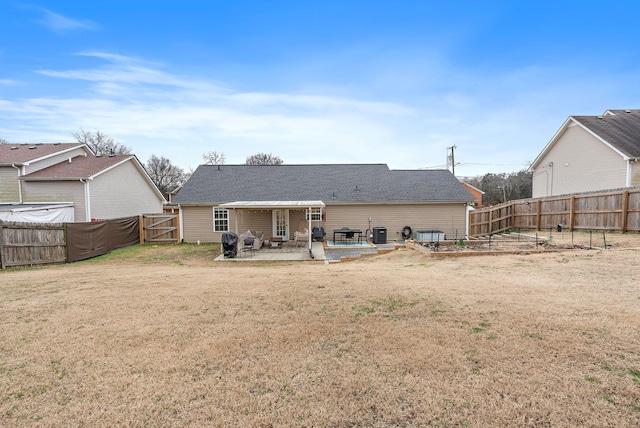 rear view of property with a patio area, a yard, and central AC unit