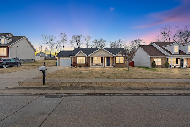 view of front of home featuring covered porch and a garage