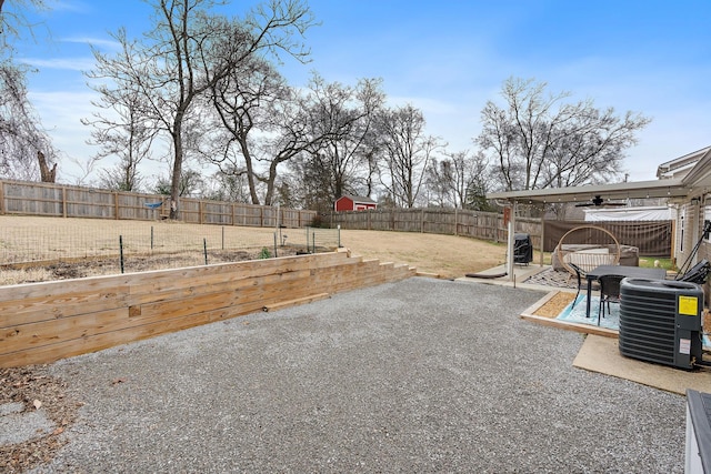 view of yard with a patio area, ceiling fan, and cooling unit