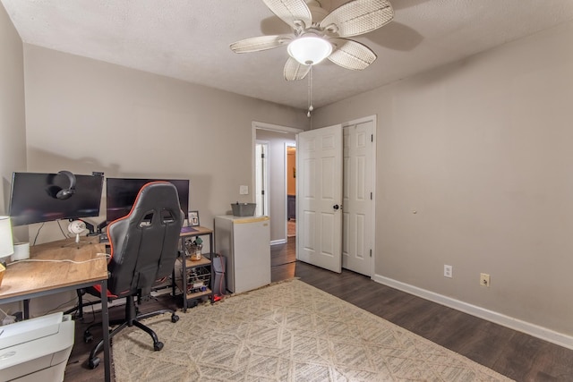 office area with ceiling fan and wood-type flooring