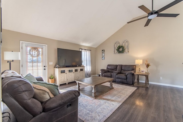 living room featuring ceiling fan, dark wood-type flooring, and vaulted ceiling