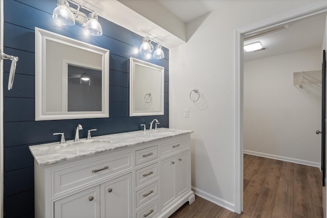 bathroom featuring hardwood / wood-style flooring and vanity