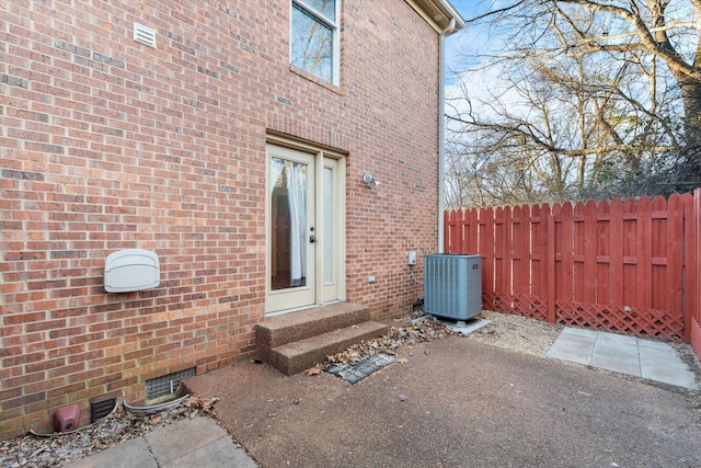 doorway to property with central AC unit