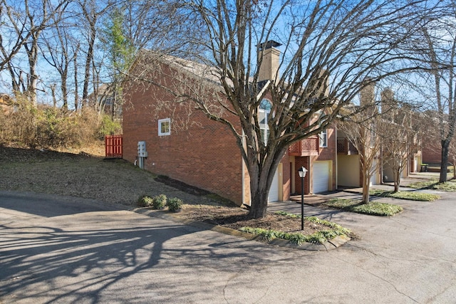 view of property exterior with a garage