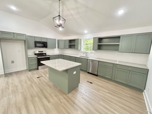 kitchen with pendant lighting, a center island, appliances with stainless steel finishes, and green cabinetry