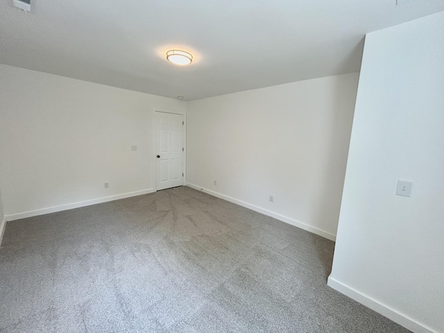 spare room featuring carpet flooring