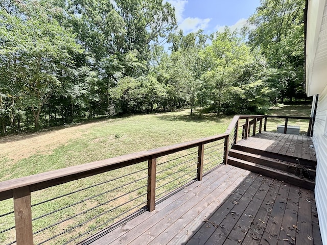 wooden terrace with a lawn