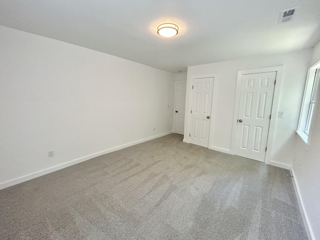 unfurnished bedroom with carpet flooring