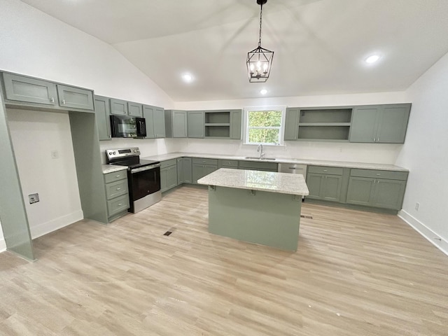 kitchen featuring sink, pendant lighting, electric range, green cabinetry, and a center island