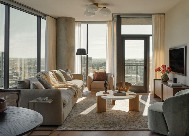 living room featuring light hardwood / wood-style flooring and expansive windows