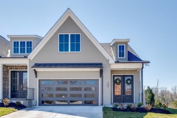 view of front of property featuring french doors and a garage