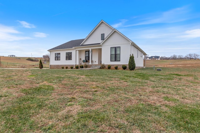 modern inspired farmhouse featuring a rural view and a front lawn