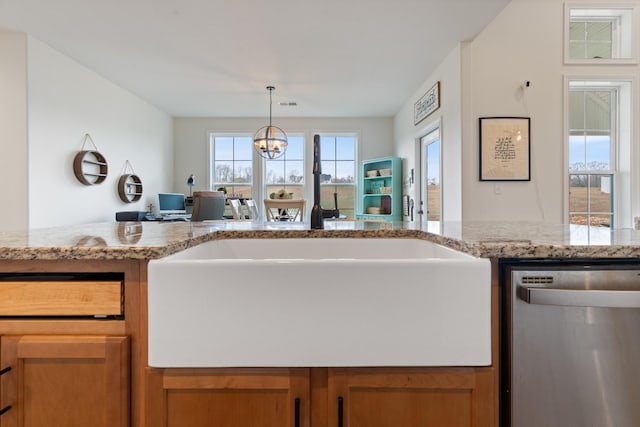 kitchen with dishwasher, light stone countertops, decorative light fixtures, and a chandelier