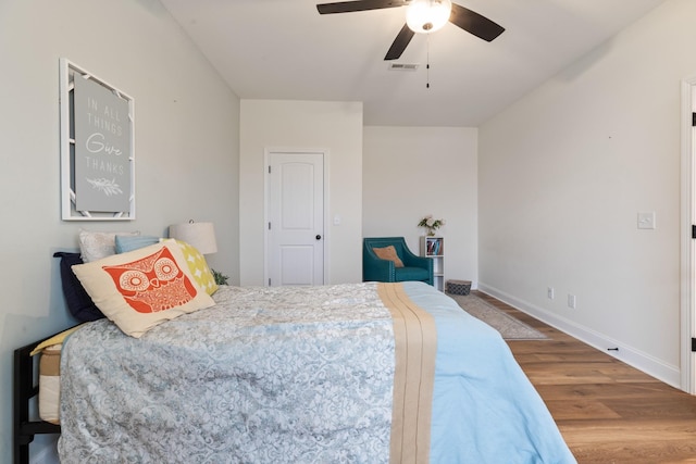 bedroom featuring ceiling fan and hardwood / wood-style floors