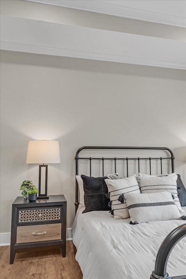 bedroom with hardwood / wood-style flooring