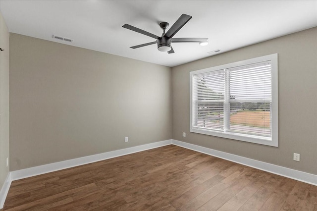 empty room featuring hardwood / wood-style flooring and ceiling fan