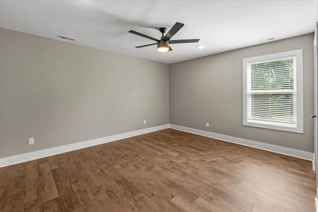 empty room featuring ceiling fan and wood-type flooring