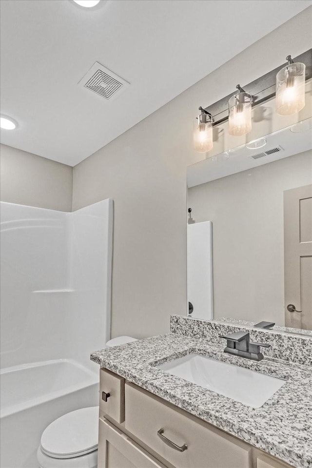 full bathroom with vanity, toilet, and tub / shower combination