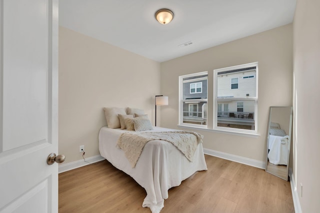 bedroom with light hardwood / wood-style flooring