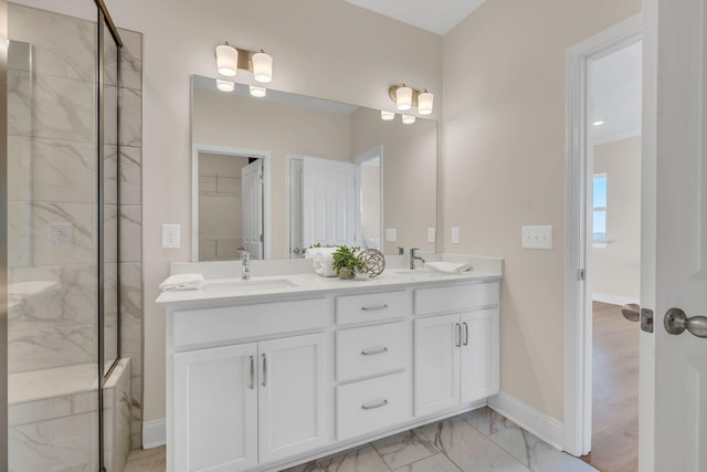 bathroom with a shower and vanity