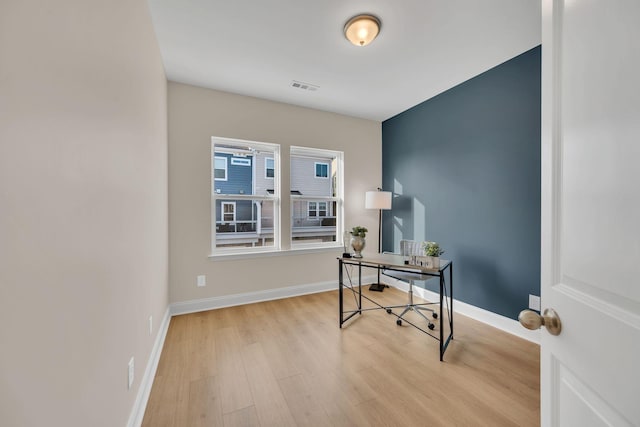 office area with light hardwood / wood-style floors