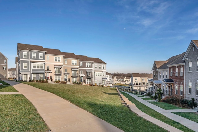 view of home's community featuring a lawn