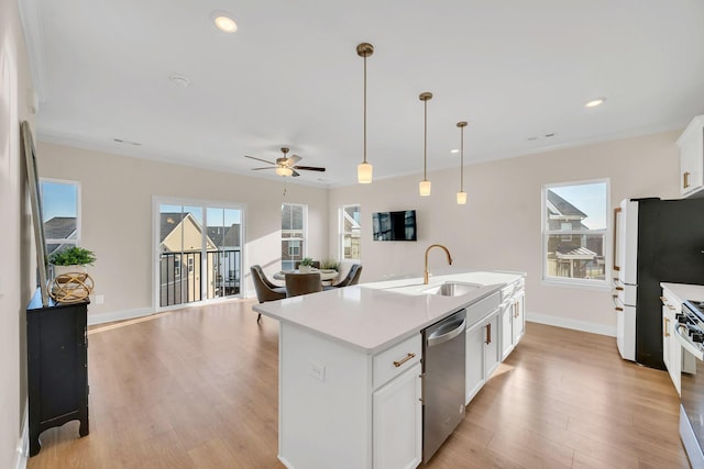 kitchen with a center island with sink, stainless steel dishwasher, ceiling fan, decorative light fixtures, and white cabinetry