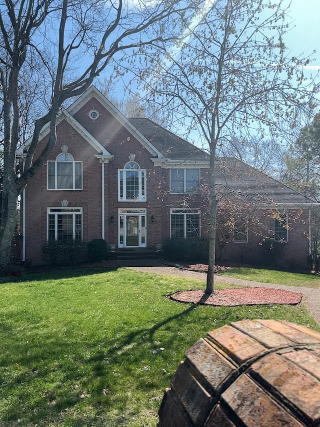 view of front of house with a front lawn