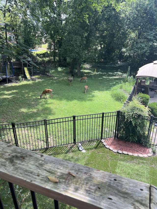 view of yard with a gazebo and a trampoline