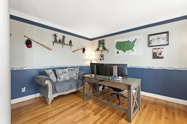 office area featuring crown molding and light hardwood / wood-style flooring