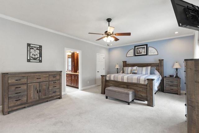 bedroom featuring ceiling fan, light colored carpet, ornamental molding, and ensuite bath