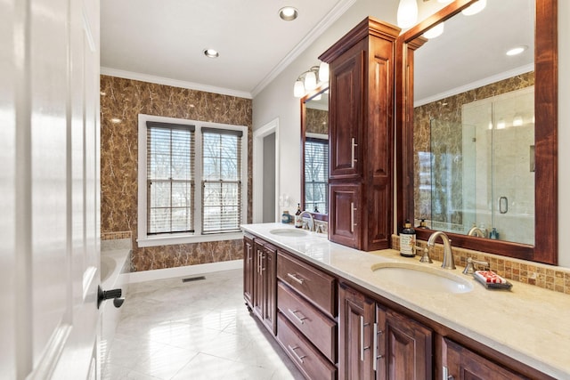 bathroom featuring a shower with door, vanity, and crown molding