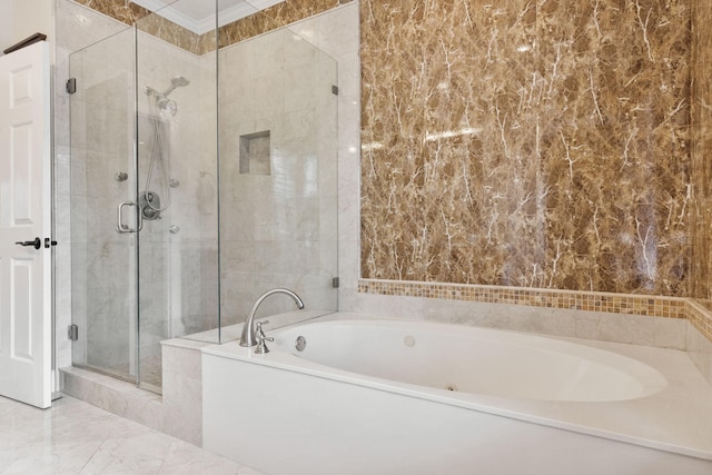 bathroom featuring separate shower and tub