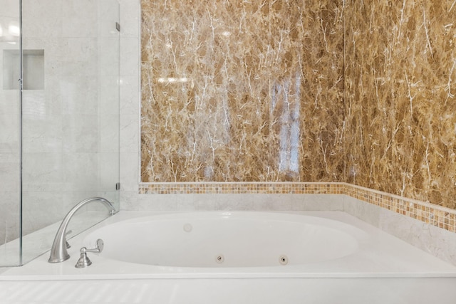 bathroom featuring a washtub