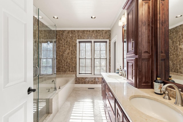 bathroom with vanity, ornamental molding, and plus walk in shower