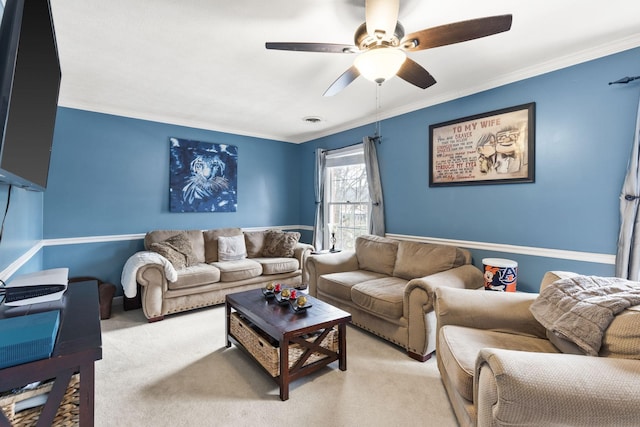 living room with light colored carpet, ceiling fan, and ornamental molding