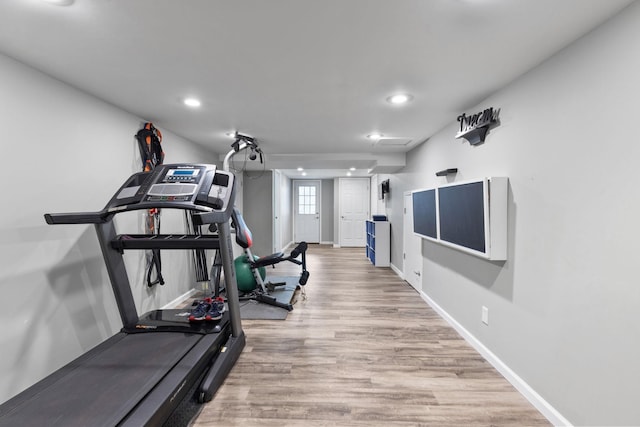 workout area with light wood-type flooring