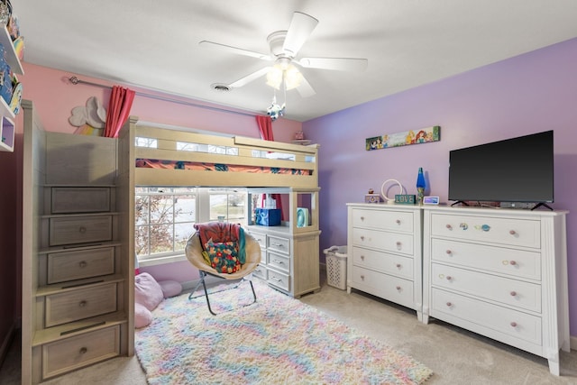 bedroom featuring ceiling fan and light carpet