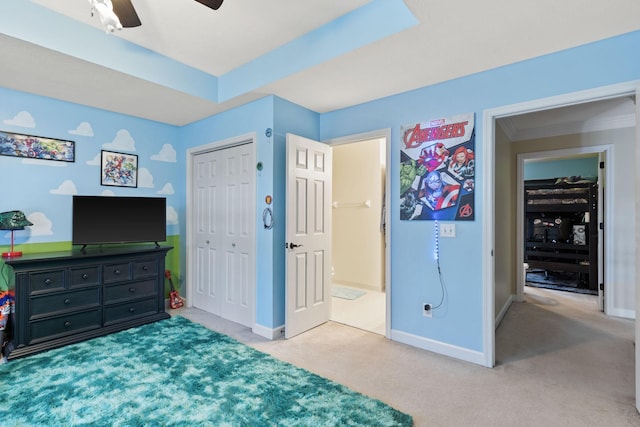 bedroom with a closet, ceiling fan, ornamental molding, and light colored carpet