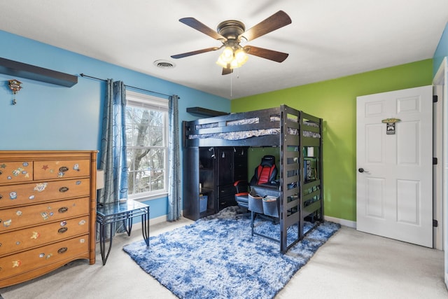 bedroom with ceiling fan and light carpet