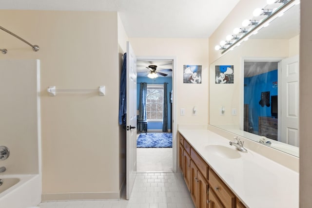 bathroom featuring shower / bath combination, ceiling fan, and vanity