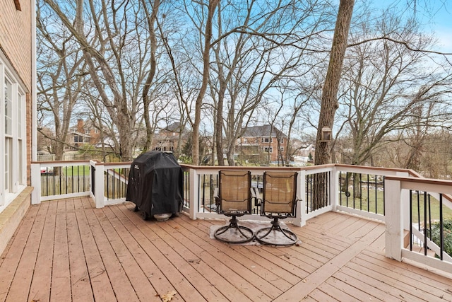 wooden deck featuring grilling area