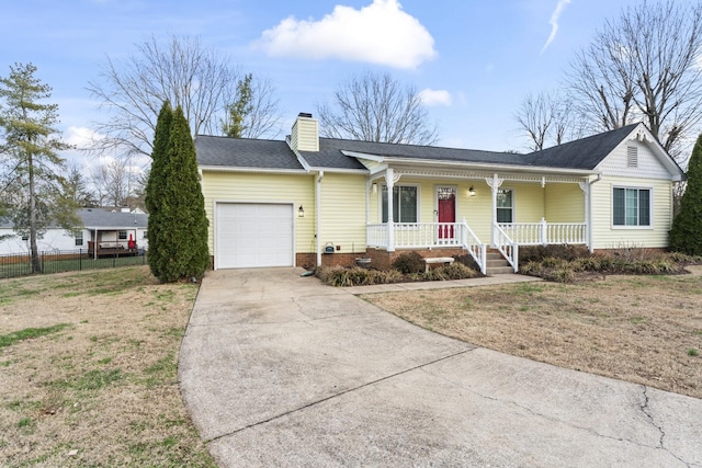 ranch-style house with covered porch, a garage, and a front yard