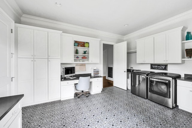 kitchen featuring independent washer and dryer and white cabinetry