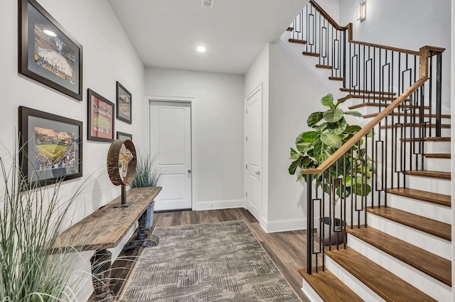 entrance foyer featuring dark hardwood / wood-style floors