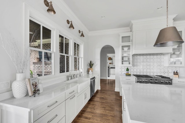 kitchen featuring pendant lighting, dark hardwood / wood-style floors, white cabinetry, and sink